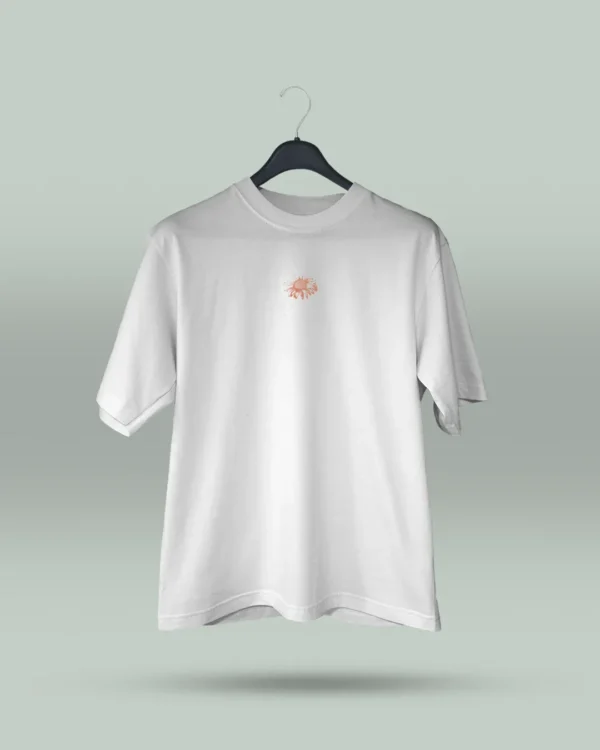 Camiseta blanca unisex con ilustración artística de flores en círculo y la frase inspiradora Eres lo que te repites. Diseño exclusivo creado por ilustrador colombiano, ideal para quienes buscan ropa original con mensajes motivadores. Disponible en tallas varias y con envíos a todo Colombia.